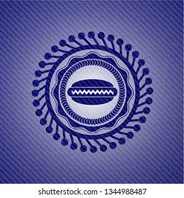 hot dog icon inside badge with denim background