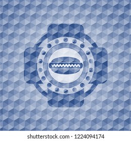 hot dog icon inside blue emblem or badge with geometric pattern background.