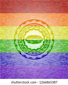 hot dog icon inside emblem on mosaic background with the colors of the LGBT flag