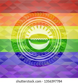 hot dog icon inside emblem on mosaic background with the colors of the LGBT flag