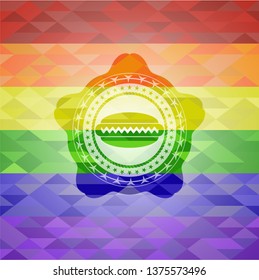 hot dog icon inside emblem on mosaic background with the colors of the LGBT flag
