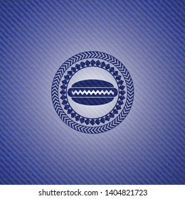 hot dog icon inside emblem with jean background