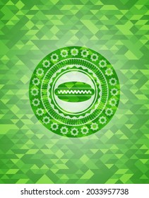 hot dog icon inside green mosaic emblem. 