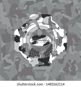 hot dog icon inside grey camouflage emblem