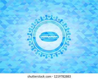 hot dog icon inside light blue emblem with triangle mosaic background