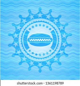 hot dog icon inside light blue water wave style emblem.