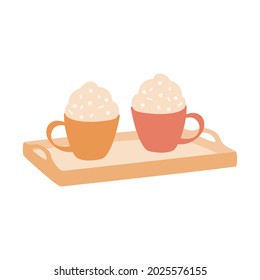 Hot drink with foam on wooden tray. Two cups of cocoa or cappuccino with sprinkling. Sweet warming beverage for autumn or Christmas cards, stickers, print.