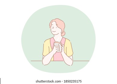 Hot drink, tea, coffee, warming up with drink concept. Young smiling woman cartoon character sitting at home or in cafe and holding mug with hot drink tea or coffee in hands vector illustration 