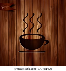 Hot drink web icon. Wooden background.