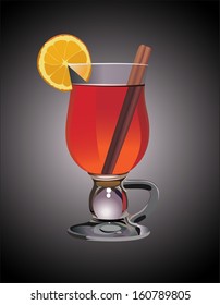 Hot mulled wine with orange slice and cinnamon sticks.