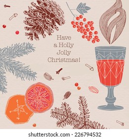 Hot wine for winter and Christmas with delicious orange and spices. Christmas greeting card.