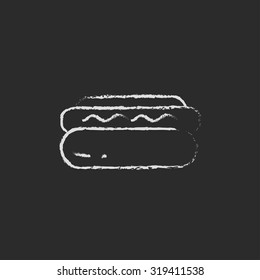 Hotdog hand drawn in chalk on a blackboard vector white icon isolated on a black background.