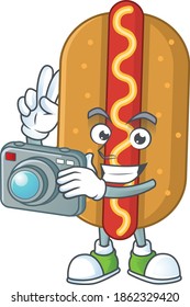 Hotdog photographer mascot design taking a picture with a camera. Vector illustration
