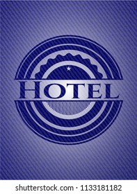 Hotel badge with denim background