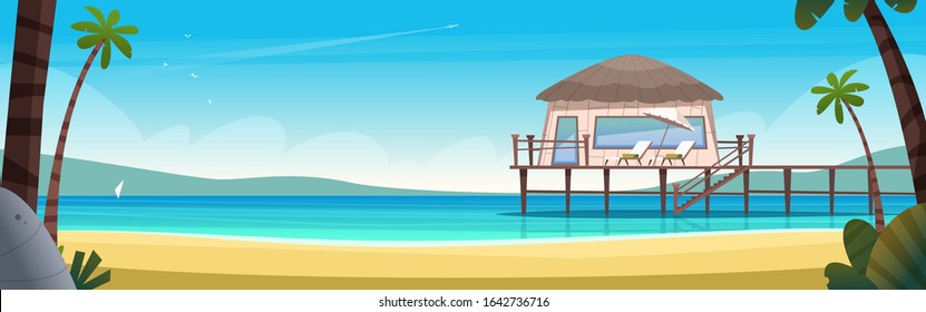 Hotel bungalow on a blue clear and calm sea. Summer vacation concept. Private house on a secluded sea beach with pier.