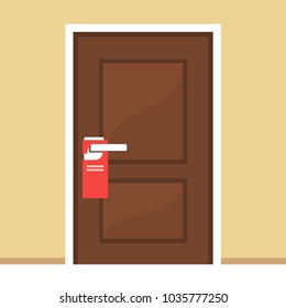 Hotel door with do not disturb sign