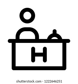 Hotel receptionist at desk