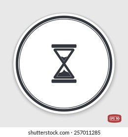 Hourglass icon. Alarm clock icon. Flat design style. Made vector illustration. Emblem or label with shadow.