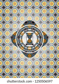 hourglass icon inside arabesque emblem background. arabic decoration.