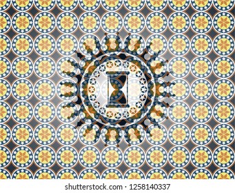 hourglass icon inside arabesque style emblem. arabic decoration.