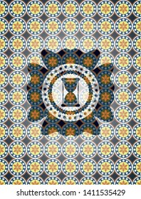 hourglass icon inside arabic style badge. Arabesque decoration.