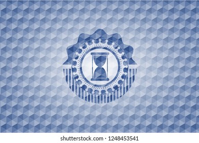 hourglass icon inside blue badge with geometric pattern background.