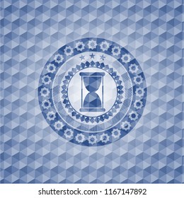 hourglass icon inside blue emblem or badge with abstract geometric pattern background.