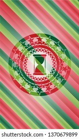hourglass icon inside christmas emblem background.
