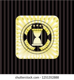 hourglass icon inside golden emblem or badge