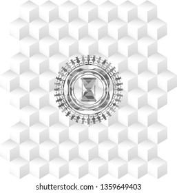 hourglass icon inside grey badge with geometric cube white background
