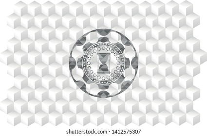 hourglass icon inside grey badge with geometric cube white background