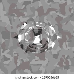 hourglass icon inside grey camouflage texture