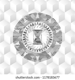 hourglass icon inside grey icon or emblem with geometric cube white background