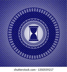 hourglass icon inside jean background