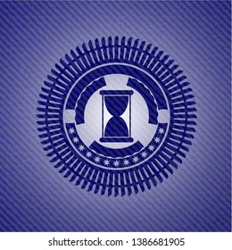 hourglass icon inside jean background
