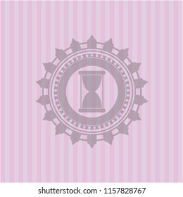 hourglass icon inside pink emblem