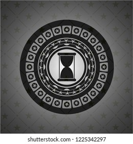 hourglass icon inside realistic black emblem