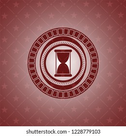 hourglass icon inside retro red emblem