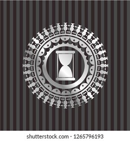 hourglass icon inside silver badge