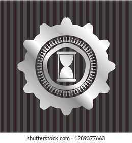 hourglass icon inside silver badge