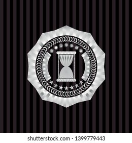 hourglass icon inside silver shiny badge