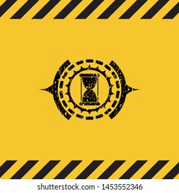 hourglass icon inside warning sign, black grunge emblem. Vector Illustration. Detailed.