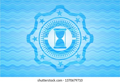 hourglass icon inside water wave concept style emblem.