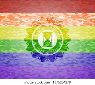 hourglass icon on mosaic background with the colors of the LGBT flag