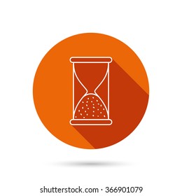 Hourglass icon. Sand end time sign. Hour ends symbol. Round orange web button with shadow.