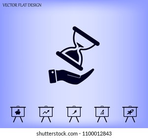 An hourglass on the hand. Vector icon.