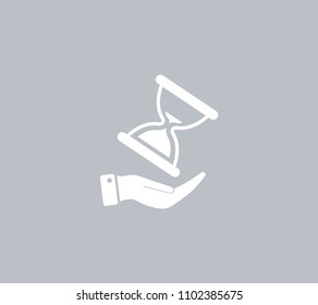 An hourglass on the hand. Vector icon.