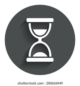 Hourglass sign icon. Sand timer symbol. Circle flat button with shadow. Modern UI website navigation. Vector