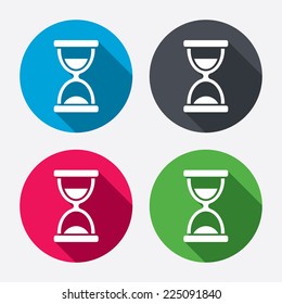 Hourglass sign icon. Sand timer symbol. Circle buttons with long shadow. 4 icons set. Vector