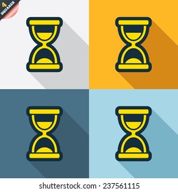 Hourglass sign icon. Sand timer symbol. Four squares. Colored Flat design buttons. Vector